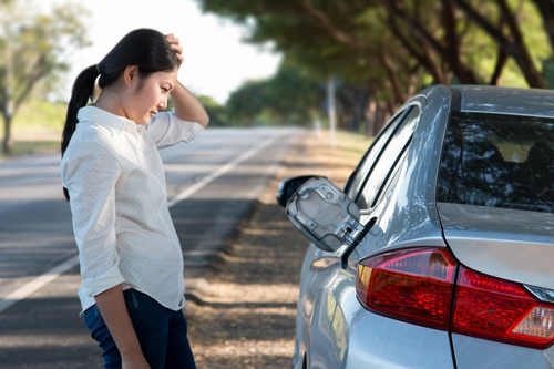 Car oil down and Young woman confusing. Car oil down and Young woman confusing.